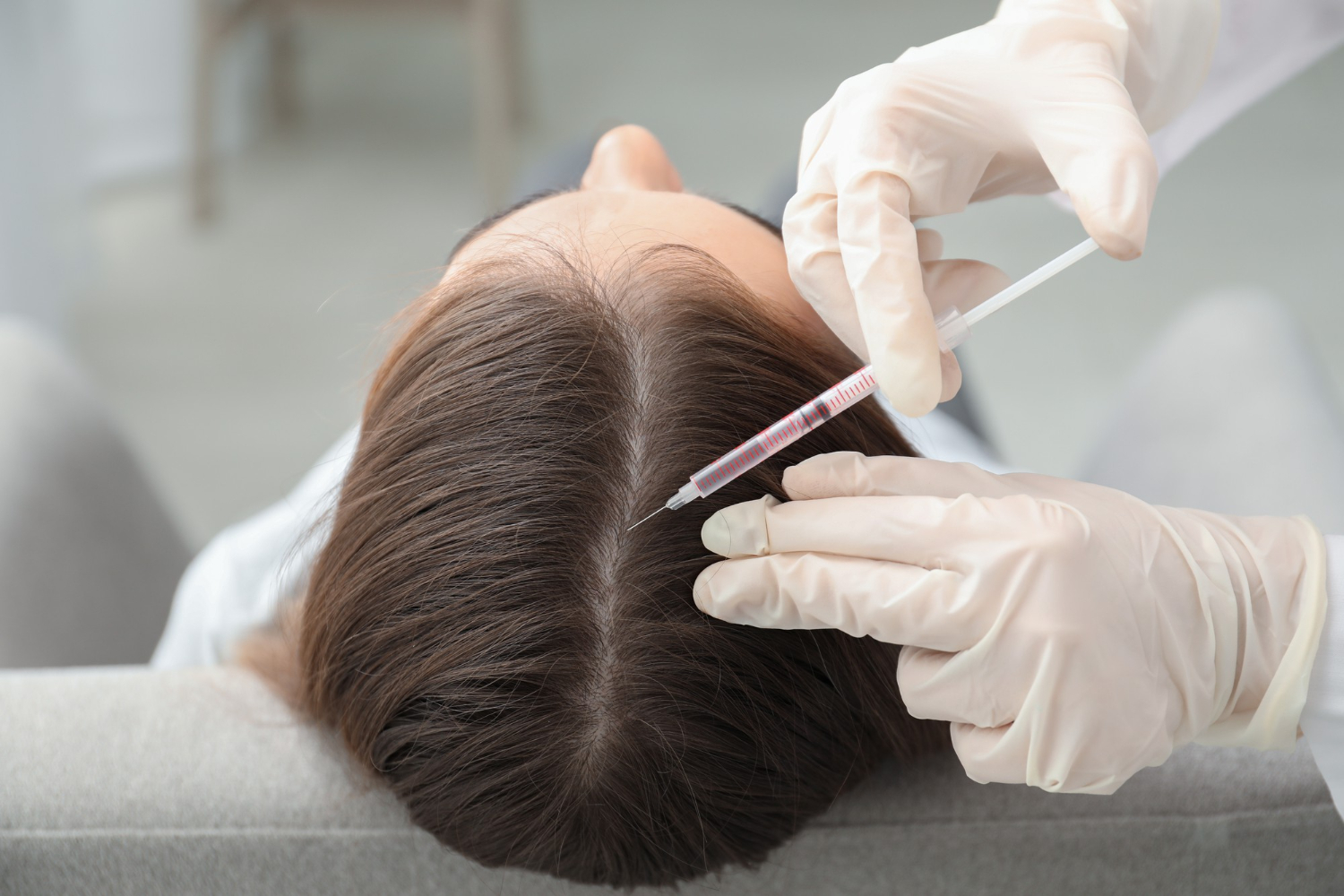 Doctor administering Dutasteride injections for hair restoration in Riyadh