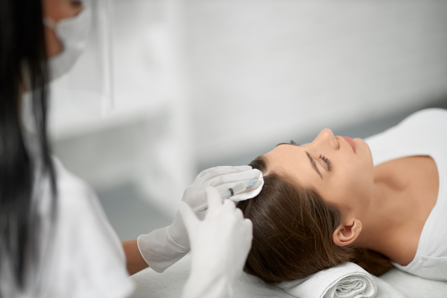Specialist injecting Magellan PRP into the scalp for hair regrowth at byHaitham