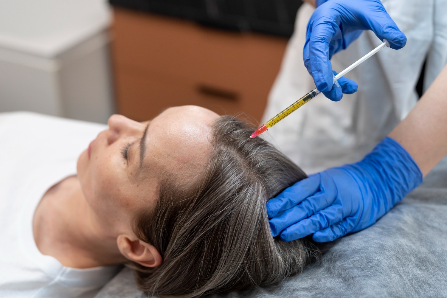 Close-up of PRP being injected into scalp for hair regrowth