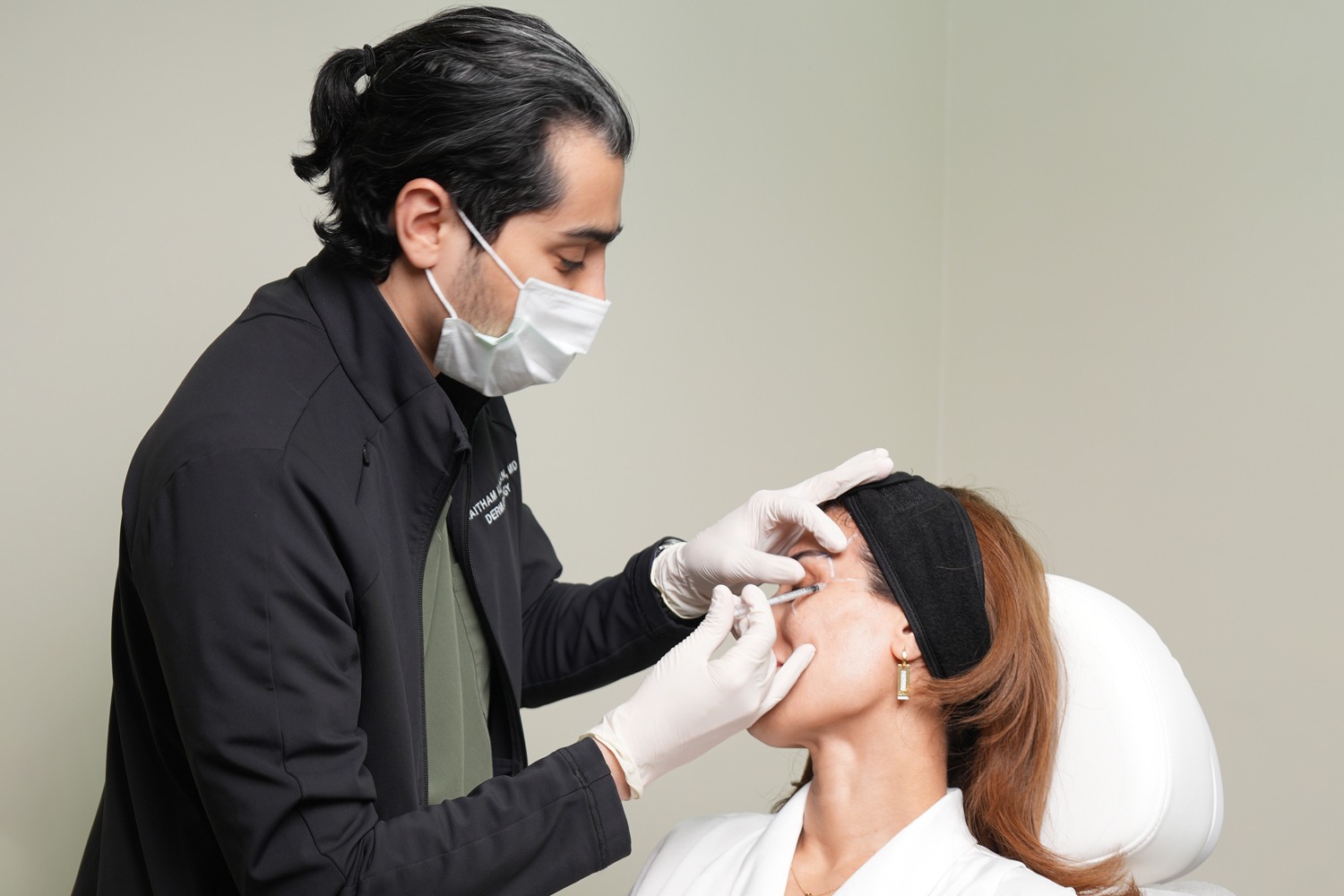 Dermatology consultation with Dr. Haitham Al-Gzlan at Reveal Clinics