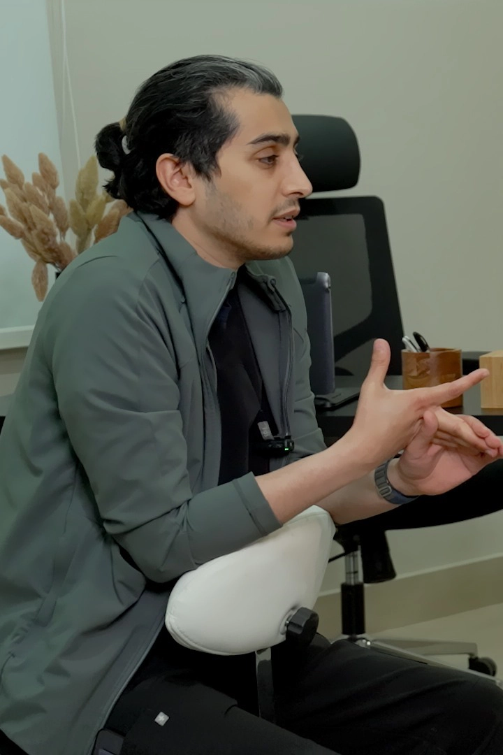 Dr. Haitham Al-Gzlan assessing acne during a dermatology consultation